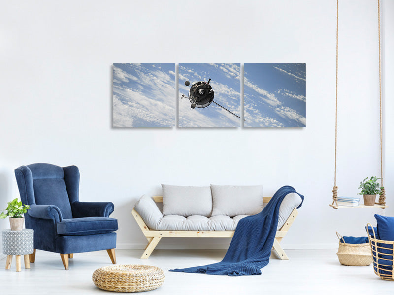 panoramic-3-piece-canvas-print-a-satellite-above-the-clouds